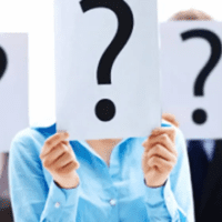 Presentation expert - David D. Doerrier People holding a board with a question mark on it.